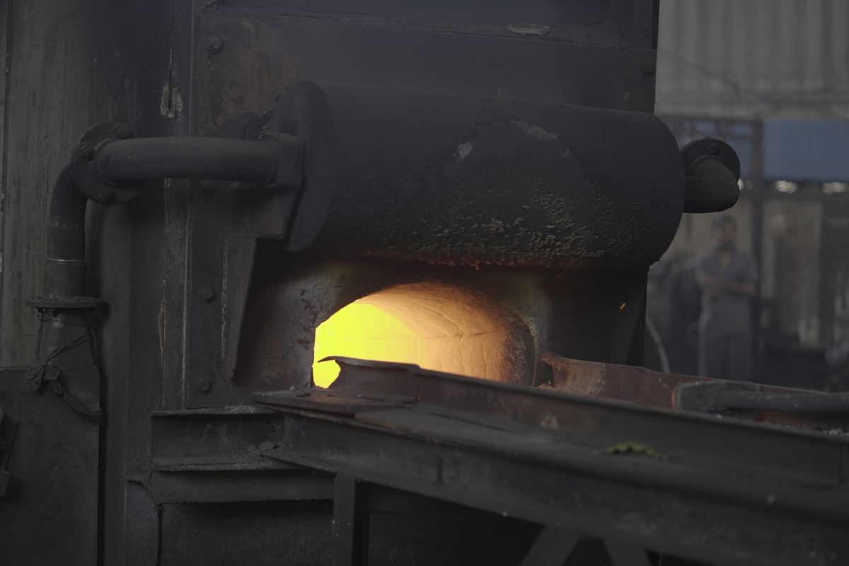 Glowing furnace mouth in the RIC forging shop